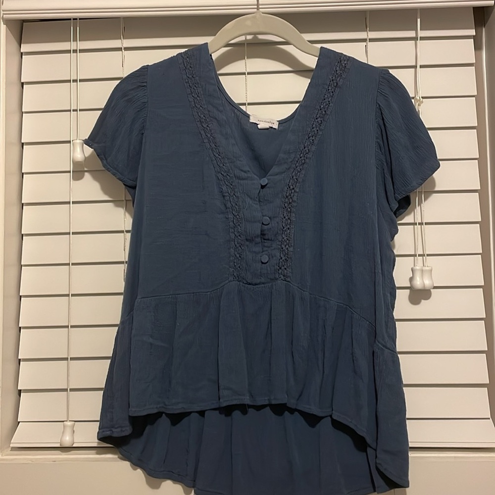 Blue boho top size L fits like a medium.